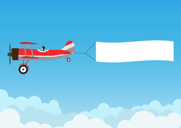retro-flugzeug fliegen mit werbebanner auf blauen himmel - vektor-illustration - flugzeug stock-grafiken, -clipart, -cartoons und -symbole