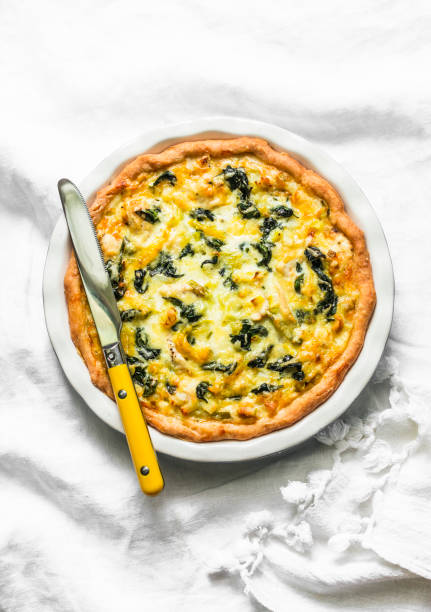 istock Spinach, leek, chicken, cheese pie on light background, top view 1097903770