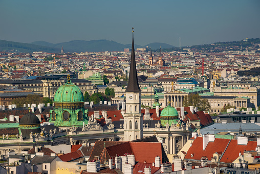 Panoramic aerial view of city center of Vienna (Innere Stadt) with St. Michael's Church, Hofburg Palace and Parliament building seen from St. Stephen's Cathedral, Austria. UNESCO World Heritage Site