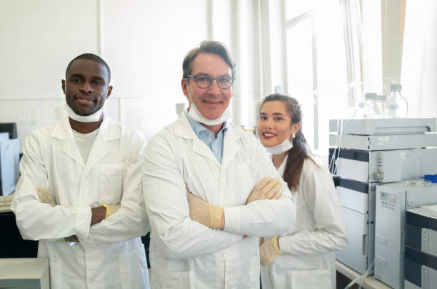 istock Teacher with a group of students in chemistry class 1097904206