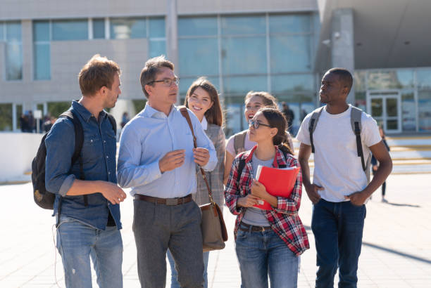 istock Teacher talking to a group of students at the university 1097904272