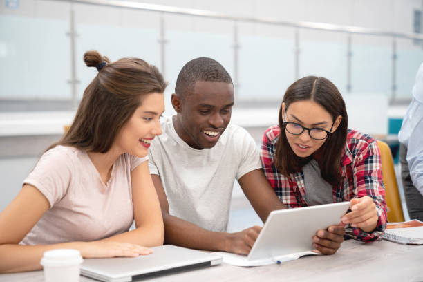 istock Happy group of students working online in class 1097904424