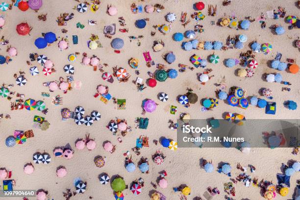 Top View Of Colourful Umbrellas And People Relaxing At The Beach On A Sunny Day Copacabana Rio De Janeiro Brazil Stock Photo - Download Image Now
