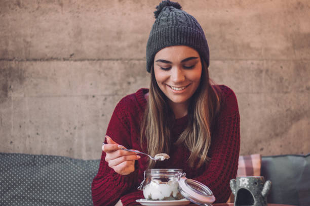 istock Cute girl enjoys her breakfas 1097904646