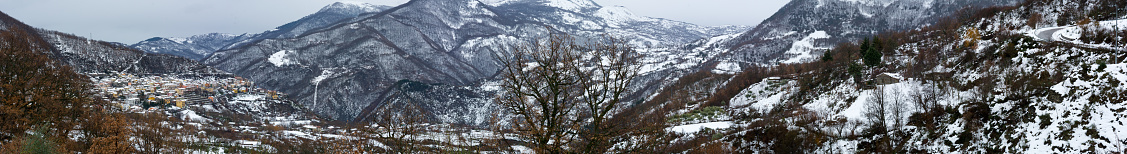 Panoramic View of the town of Terranova di Pollino in Winter, Covered with Snow. National Park of Pollino, Italy