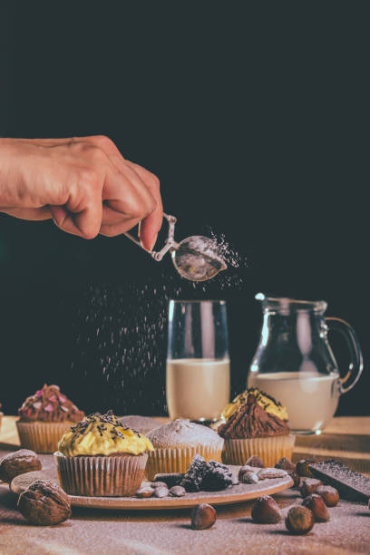 istock Fresh muffins and cupcakes sprinkled with sugar 1097910036