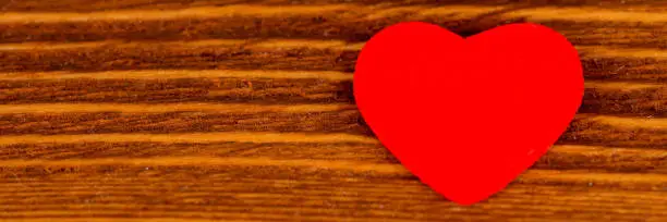 red heart on rustic wooden desk, valentine's day wide background