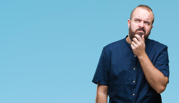 istock Young caucasian hipster man over isolated background thinking looking tired and bored with depression problems with crossed arms. 1097918294