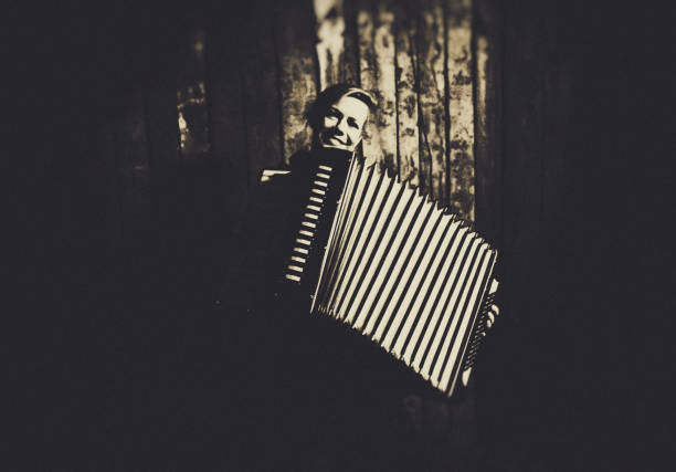 istock Young Woman with old Accordion 1097918902