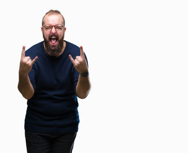 istock Young caucasian hipster man wearing sunglasses over isolated background shouting with crazy expression doing rock symbol with hands up. Music star. Heavy concept. 1097920680