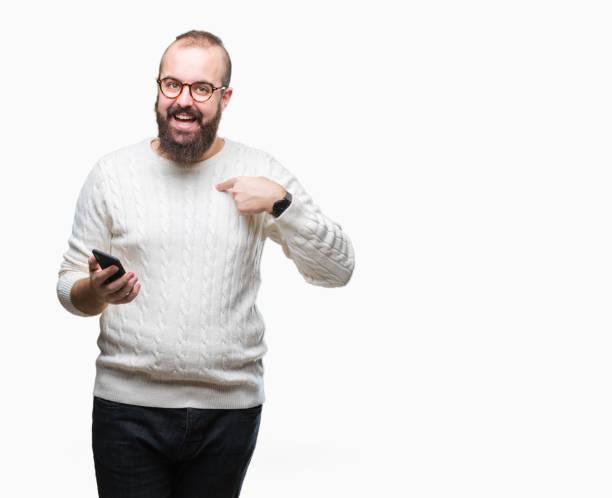 istock Young caucasian hipster man texting sending message using smartphone over isolated background with surprise face pointing finger to himself 1097921756
