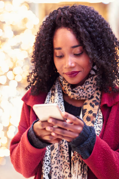 istock Woman using phone on a winter day 1097922592