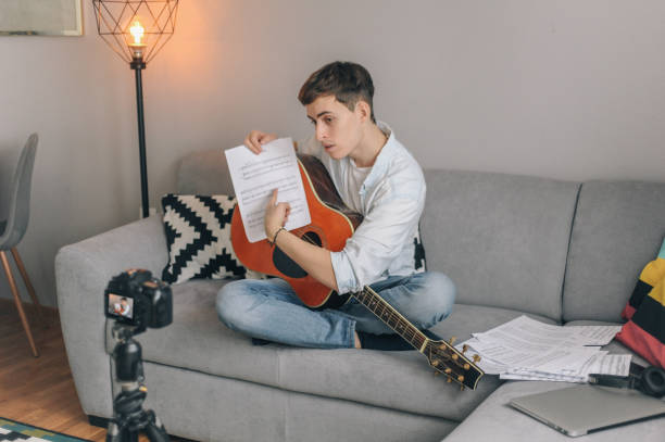istock Young vlogger, guitarist filming his vlogg 1097923360