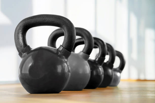 istock Colorful kettlebells in gym 1097923418