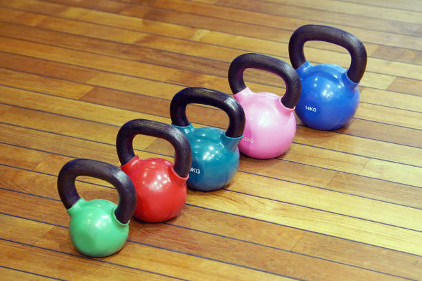istock Colorful kettlebells in gym 1097923440