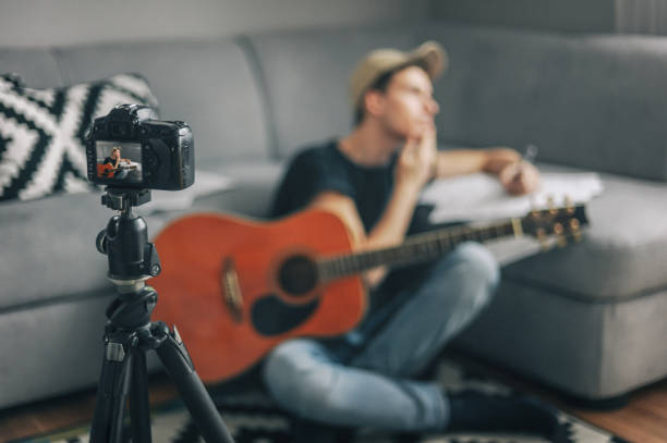 istock Young vlogger, guitarist filming his vlogg 1097923732