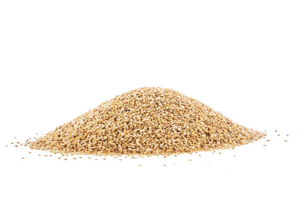 istock Heap of raw, uncooked quinoa seed on white background 1097930246