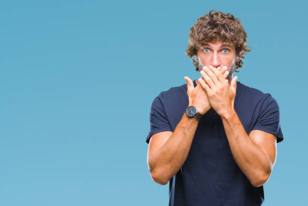 istock Handsome hispanic model man over isolated background shocked covering mouth with hands for mistake. Secret concept. 1097930840
