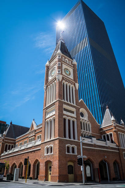 Perth Town Hall in Western Australia old brick building in front of modern skyscrapers stock photo