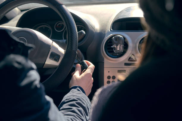 istock Millenial putting the key to start the car 1097950938