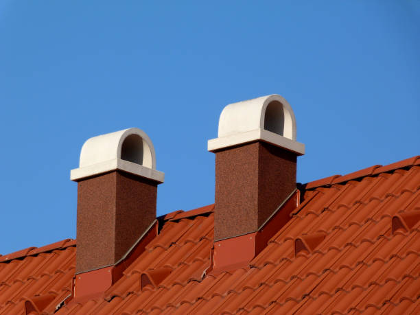 istock modern brown stucco chimneys with white cap stones 1097951612