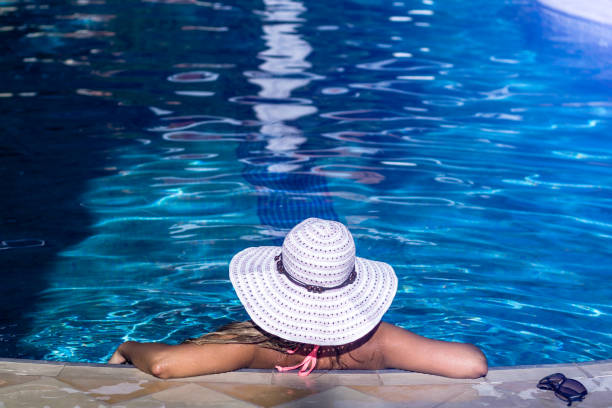 istock Woman relaxing in pool 1097955976