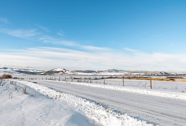 istock White winter snowy mountain road 1097956016