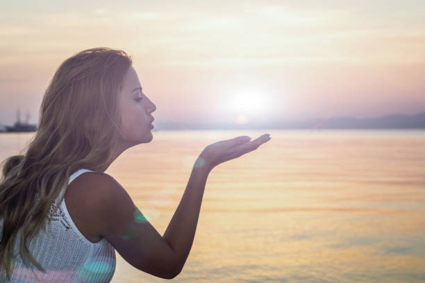 istock Woman enjoy on the beach at sunset 1097957186
