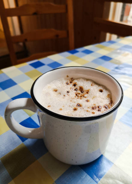 istock Cup of hot chocolate or mocha on a checked tablecloth 1097957328