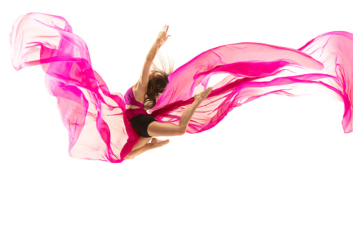 Graceful ballet dancer or classic ballerina dancing isolated on white studio. Woman dancing with pink silk cloth. The dance, performer, flexibility, elegance, performance, grace, artist, contemporary concept