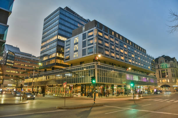 Street view in Stockholm Stockholm, Sweden - November 17, 2018. Street view in Stockholm, with residential and commercial buildings, commercial properties, street traffic and blurred figures of people. stockholm town square sergels torg sweden stock pictures, royalty-free photos & images