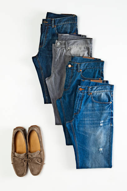 istock Blue jeans with loafers isolated on white background 1097968486