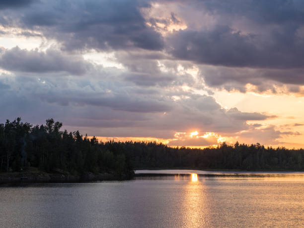 istock sunset over a forest lake in summer 1097971056