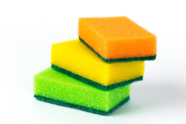 three multi-colored sponges for washing dishes isolated on white background three sponges for washing dishes isolated on white background cleaning sponge photos stock pictures, royalty-free photos & images