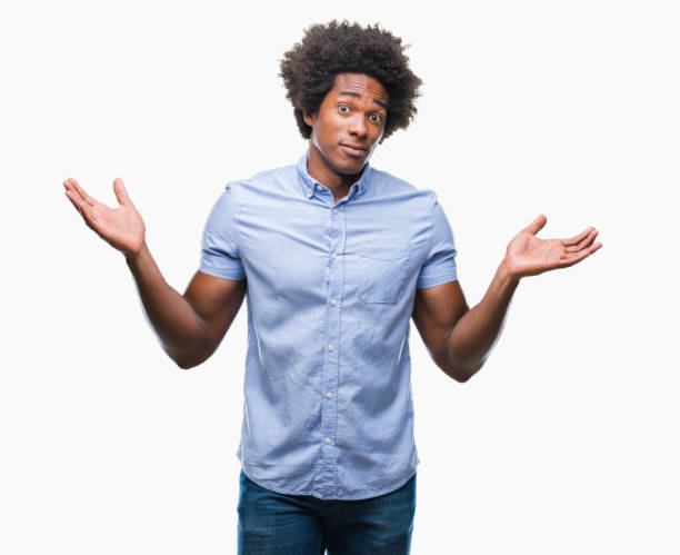 istock Afro american man over isolated background clueless and confused expression with arms and hands raised. Doubt concept. 1097974348