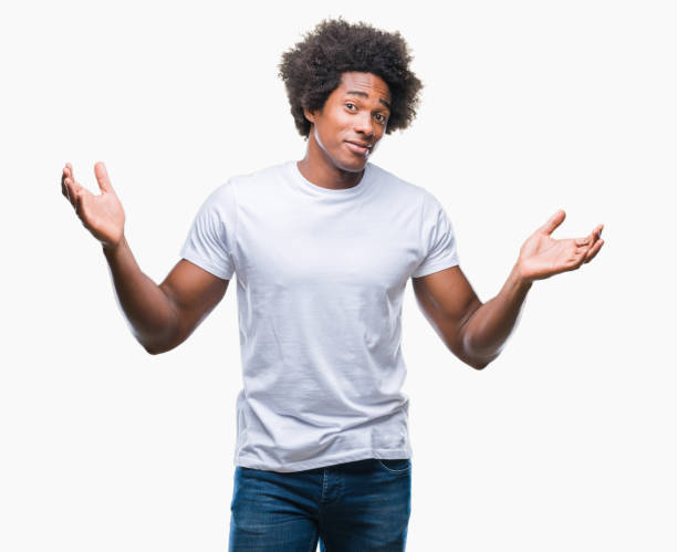 istock Afro american man over isolated background clueless and confused expression with arms and hands raised. Doubt concept. 1097974406
