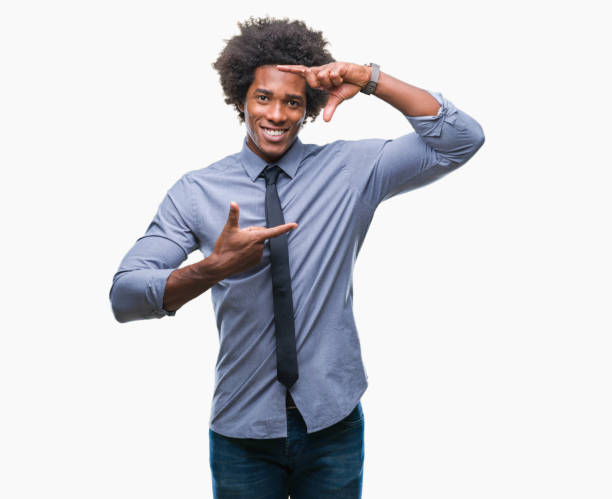 istock Afro american business man over isolated background smiling making frame with hands and fingers with happy face. Creativity and photography concept. 1097974992