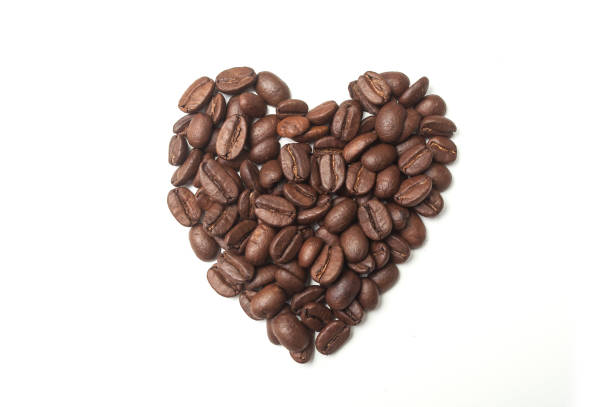 istock coffee beans in shaped heart on white background 1097977548