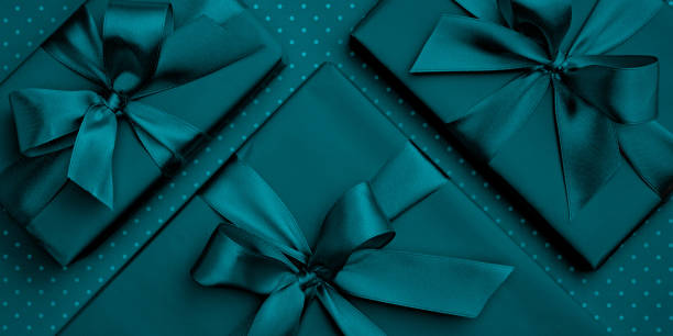istock Blue or turquoise gift box flat lay composition Valentines day or Womens day, greeting card birthday with present box on dark turquoise background. Concept holiday decoration top view for Mothers day 1097980758