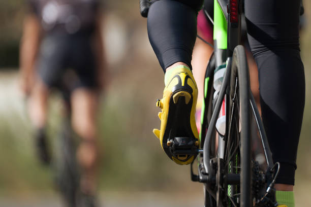 cycling competition cyclist athletes riding a race at high speed - bicycle pedal imagens e fotografias de stock