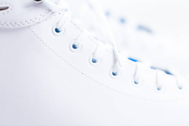 istock New white figure skates on a white background. 1097983096