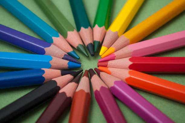 istock colorful pencil on green paper background 1097986214