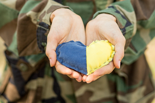Heart made from yellow and blue fabric. Love, pray for Ukraine