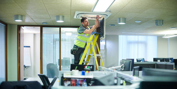 air con maintenance engineer air con maintenance engineer in empty office floor facility maintenance stock pictures, royalty-free photos & images