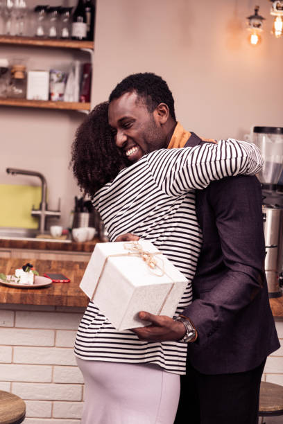 istock Delighted nice positive woman hugging her boyfriend 1097992786