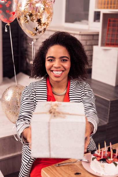 istock Nice cheerful woman taking her birthday present 1097992822