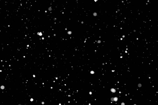 istock Texture of snow isolated on black background 1097993054