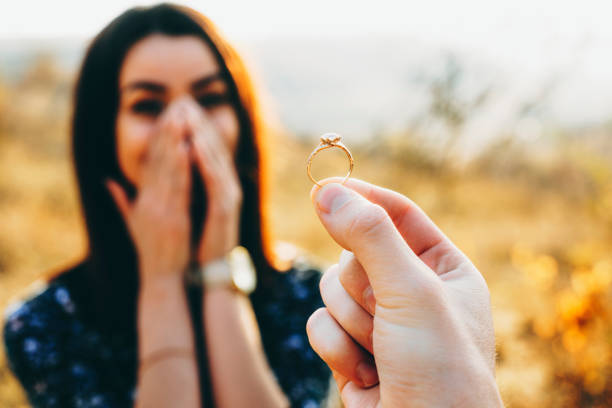 istock Crop hand proposing to shocked woman 1097993294