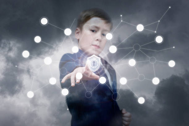 istock A teenage boy is touching a shield inside the digital system. 1097993648