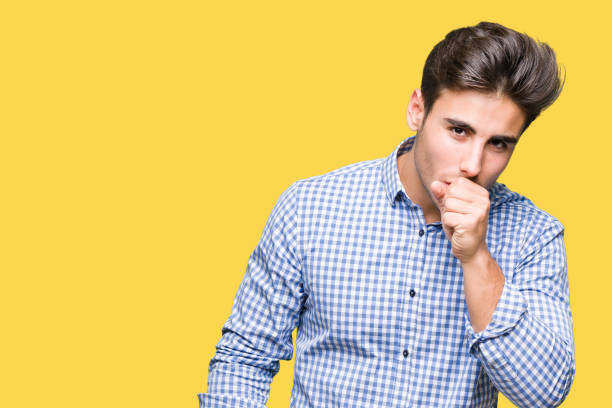 istock Young handsome business man over isolated background feeling unwell and coughing as symptom for cold or bronchitis. Healthcare concept. 1097995332